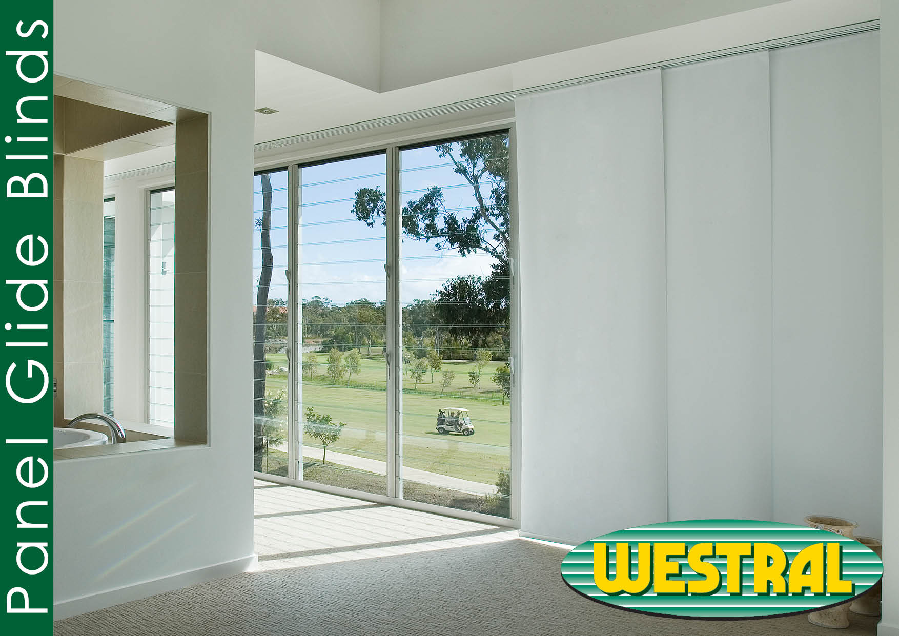 Modern living room featuring white panel blinds, offering privacy and light control. A golf course view is visible through the window.