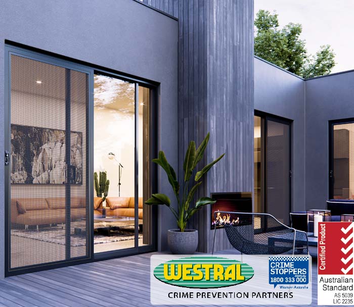 Westral security screen door, Crime Stoppers Western Australia crime prevention partnership. Patio view with furniture, plant, and fireplace.