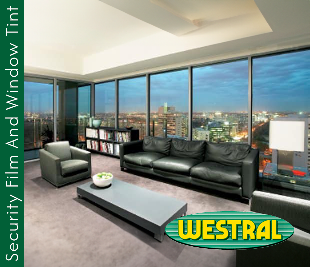 Modern living room with a city view through window tint. Security film on windows adds privacy and protection. Westral window tinting.